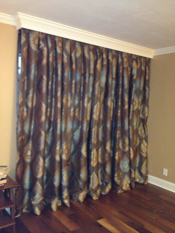 Drapes, a definite improvement over the vertical slat blinds.