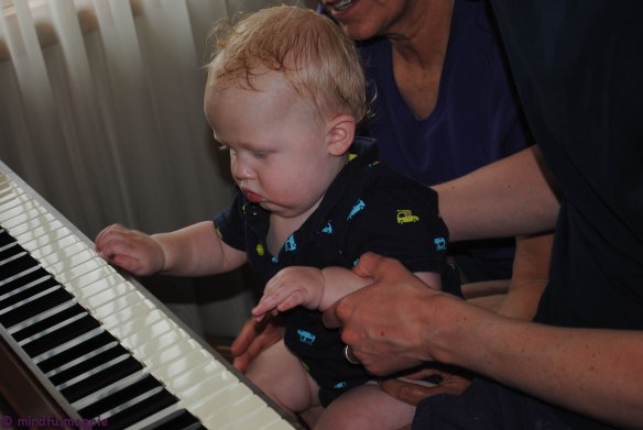 Playing the piano after his bath